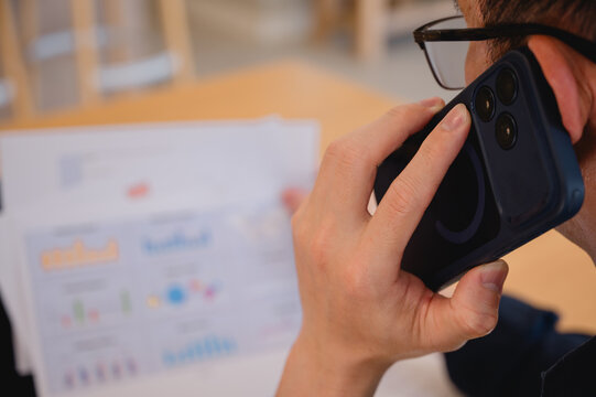 Social media marketing concept. Businessman hand using smartphone typing, chatting conversation in chat box icons pop up
