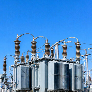 Power distribution equipment with insulators and busbars at a substation, energy infrastructure