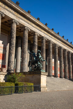 Berlin, Germany; 1st October 2026: Altes Museum in Berlin showcases monumental neoclassical columns beside a sunny green lawn
