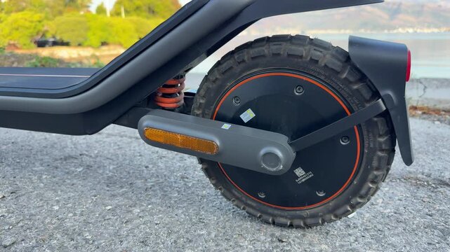 Electric Scooter Rear Wheel and Suspension Close-Up