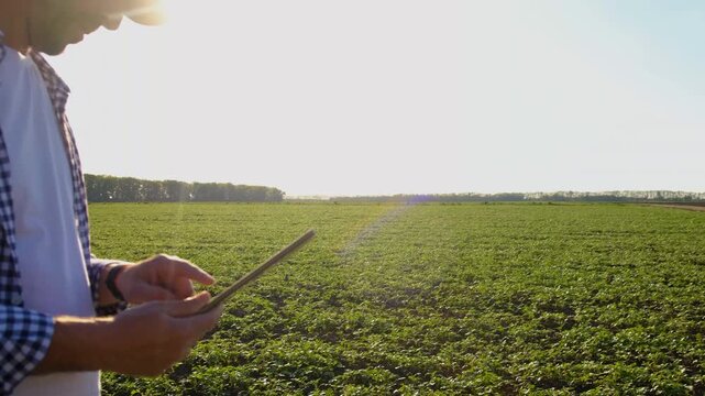Farmer in the field. Selective focus.