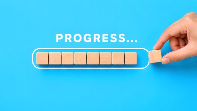 Hand Placing Wooden Block for Progress