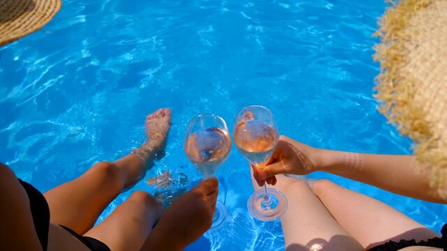 Champagne by the pool. Selective focus.