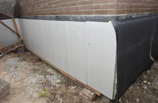 Foundation waterproofing and insulation installation
