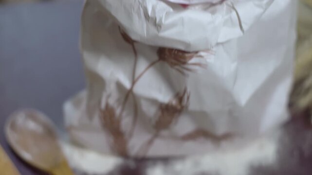 Flour sack closeup rustic kitchen table. Camera pan rolling pin, baking tools.