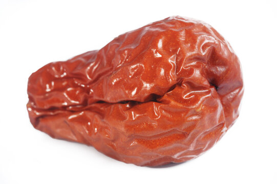 Dried red jujubes on white background