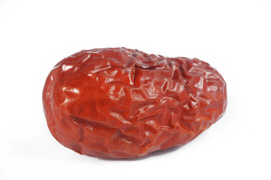 Dried red jujubes on white background