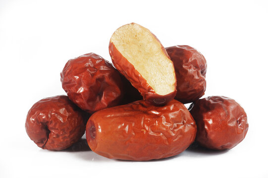 Dried red jujubes on white background