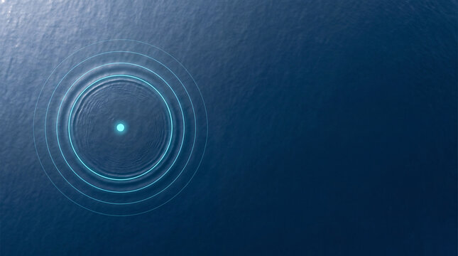 Glowing Cyan Ripple on Calm Deep Blue Ocean Surface, Aerial View
