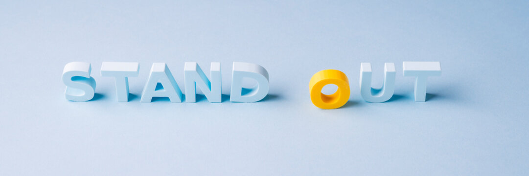 Stand out, differentiation and uniqueness concept with one contrasting yellow letter
