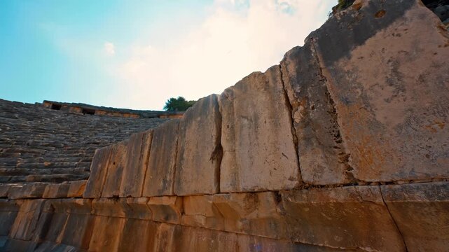 Myra in Antalya, Turkiye features close-up details of ancient stone ruins and weathered architectural fragments.