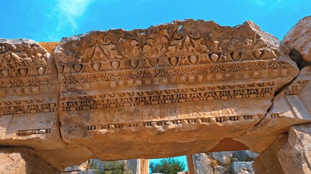 Myra in Antalya, Turkiye features close-up details of ancient stone ruins and weathered architectural fragments.