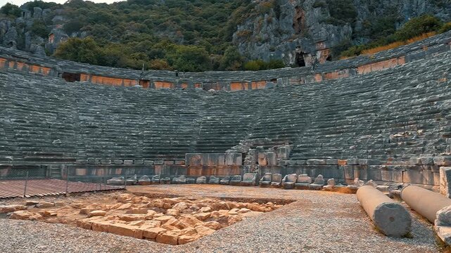 Myra Ancient Theatre in Demre, Antalya, Turkiye, unveils the grandeur of Roman architecture as the camera moves smoothly from right to left.