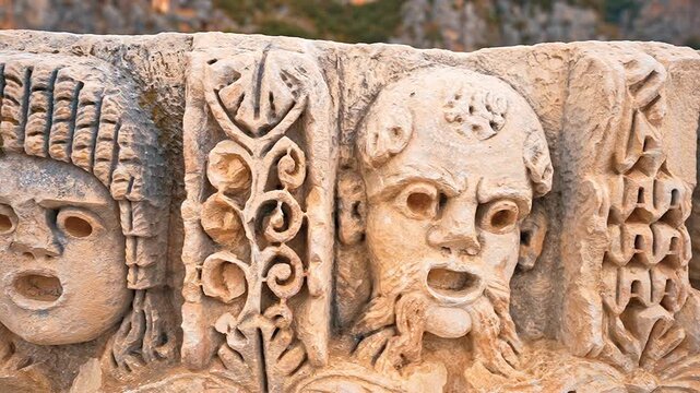 Myra Ancient City in Demre, Antalya, Turkiye, reveals detailed stone faces in a smooth camera movement from left to right.