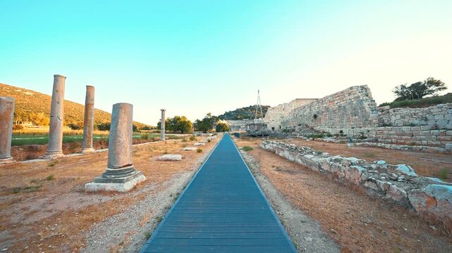 Patara Ancient City in Antalya, Turkiye, features stone ruins, ancient columns, and archaeological remains reflecting the rich legacy of Lycian civilization.