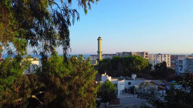 Small village with morning in state of Jijel, Algeria, rural village, A beautiful Mediterranean village in North Africa, Algeria from above, A small town overlooking the Mediterranean sea.