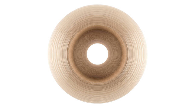 Top view of a single beige skateboard wheel isolated on a clean white studio background surface