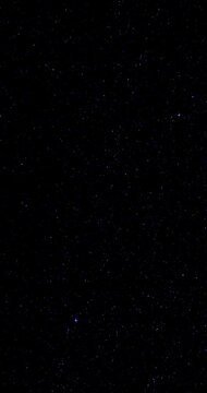 Rotating Starry Sky with Sparkling Pointed Stars. Rotating star field glimmers with tiny pointed stars against black. This starry sky effect brings gentle motion and sparkling detail to dark backdrop.