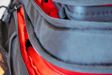 • Macro detail of black mesh pocket and zippers on a modern backpack © Karnok