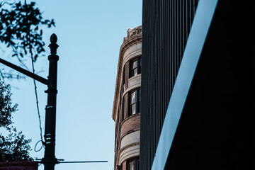 Historic building corner framed by dark vertical facade lines © Look Around Studio
