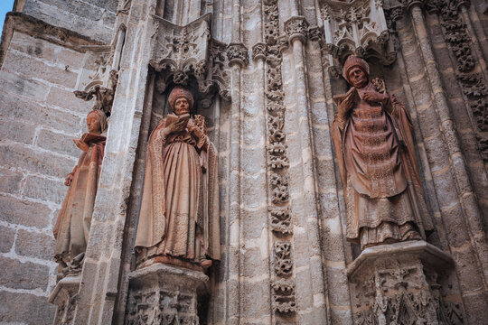 Gothic saint statues on Seville Cathedral facade