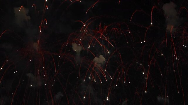 Amazing real beautiful colorful fireworks background on celebration night event for happy new year party or independence day, Abstract Multi color golden firework in the night sky