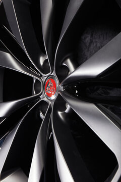 Katowice, Poland - July 12, 2018: Close up of Jaguar alloy wheel with red logo on black background