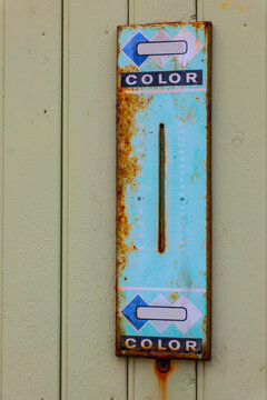 Old rusty wall thermometer with Celsius and Fahrenheit scales