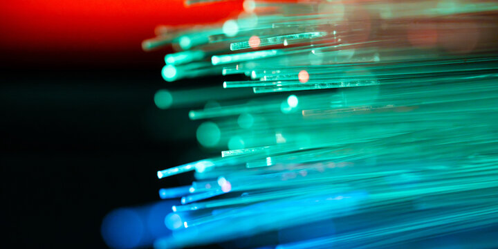 Glowing fiber optic strands for high-speed data transmission