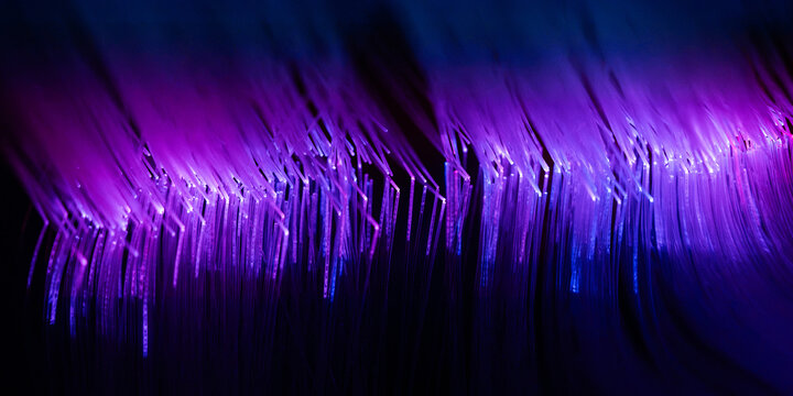 Purple fiber optic light pattern for technology background