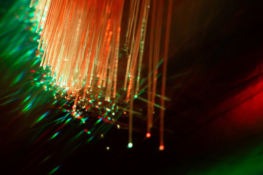 Glowing fiber optic strands for technology background
