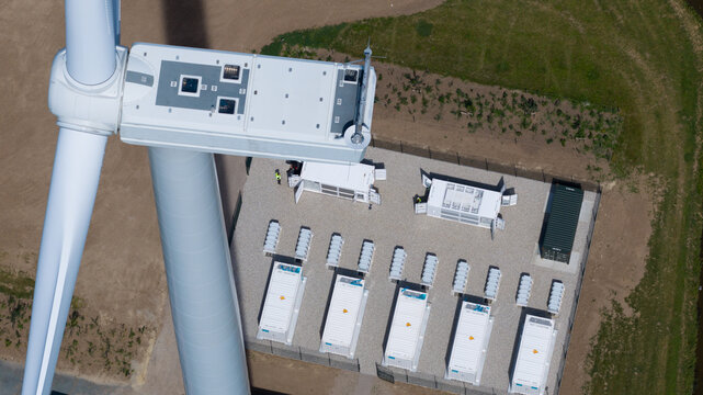 Aerial view of wind turbine and battery energy storage system