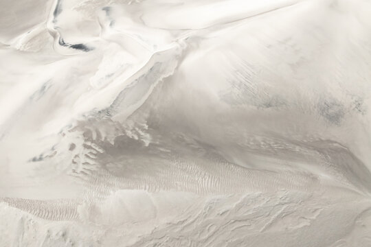 White desert dunes with abstract sand pattern background