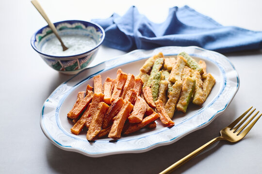 Baked zucchini and sweet potato fries with creamy dip