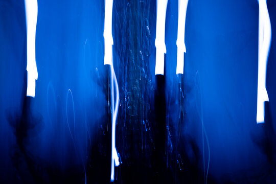 Abstract blue light painting with long exposure motion blur