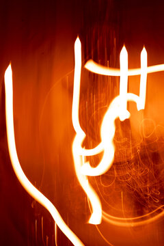 Abstract orange light painting with long exposure motion blur