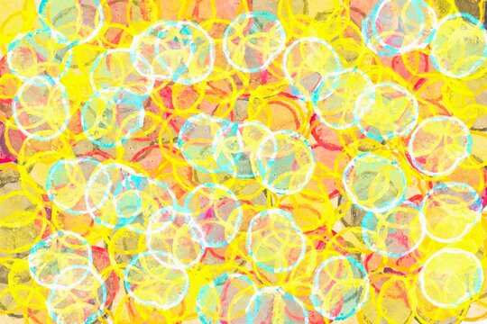 Abstract bokeh circles pattern in vibrant yellow and turquoise