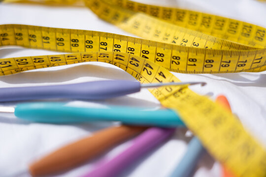Crochet hook and measuring tape for handmade craft project