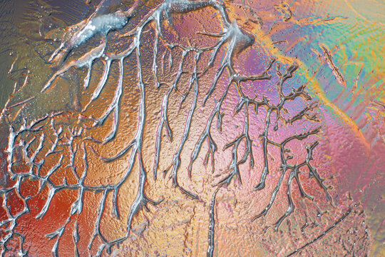 Colorful cracked ice texture with iridescent abstract pattern