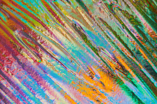 Colorful abstract paint texture with diagonal layered strokes