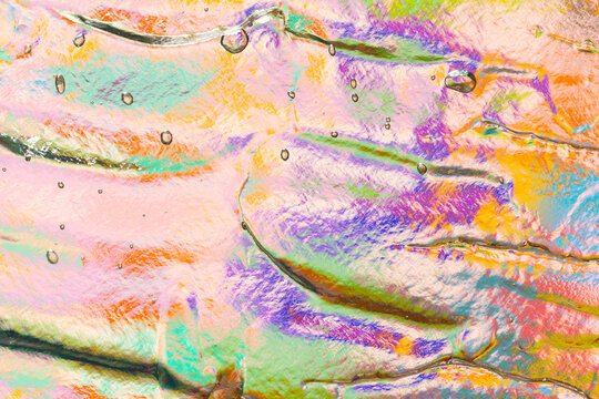 Colorful abstract ice texture with water droplets