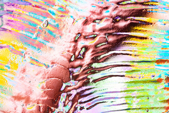 Colorful abstract water texture with vivid paint streaks