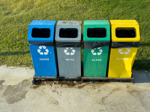 Color-coded recycling bin for waste sorting outdoors