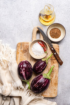 Raw eggplant and spice ingredients for home cooking