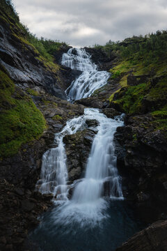 Cascading waterfall in the rocky fjord landscape of norway