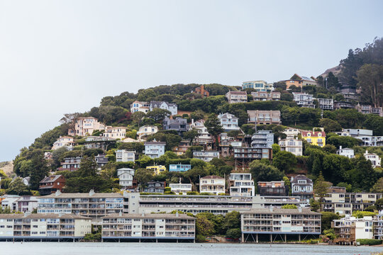 Waterfront houses and residential hillside buildings overlooking the bay in Sausalito California