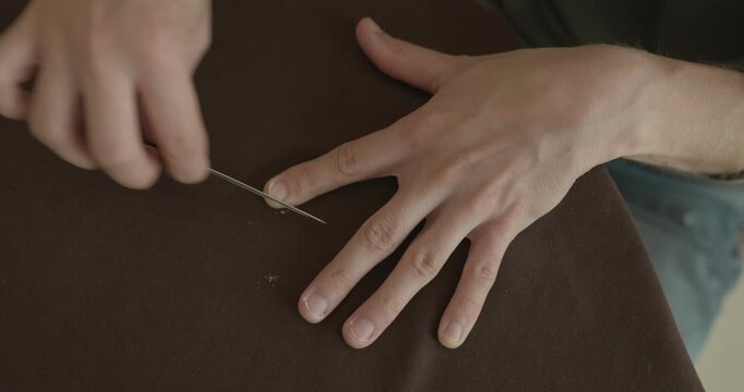Close-up male hands do filing nails manicure. 4K 10-bit