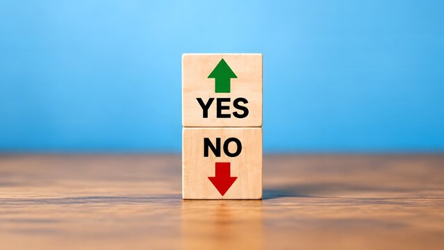 Stacked wooden blocks with yes and no text and directional arrows, representing decision making, choices, dilemmas, and binary options in a business context.