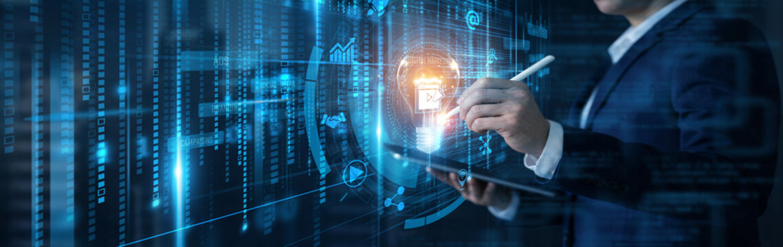 Businessman analyzing data with tablet for digital marketing and online promotion innovation concept on futuristic interface. Social media, brand strategy, advertising campaigns, outreach.