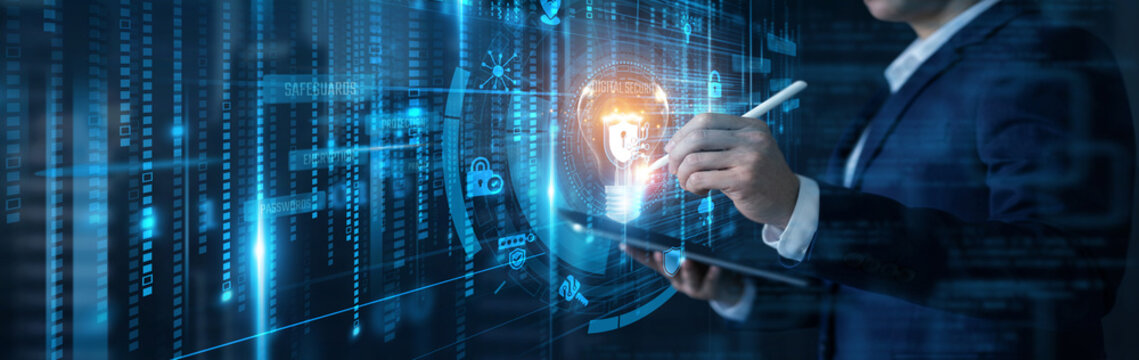 Businessman analyzing data with tablet for digital security and information protection innovation concept on futuristic interface. Cyber defense, encryption, data privacy, network safety.